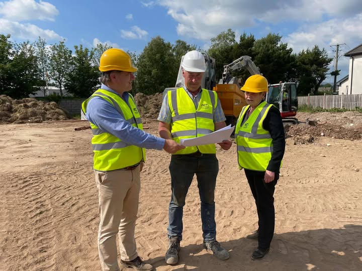 Des Cooney owner of Cooney Construction looking at plans on site for a housing development